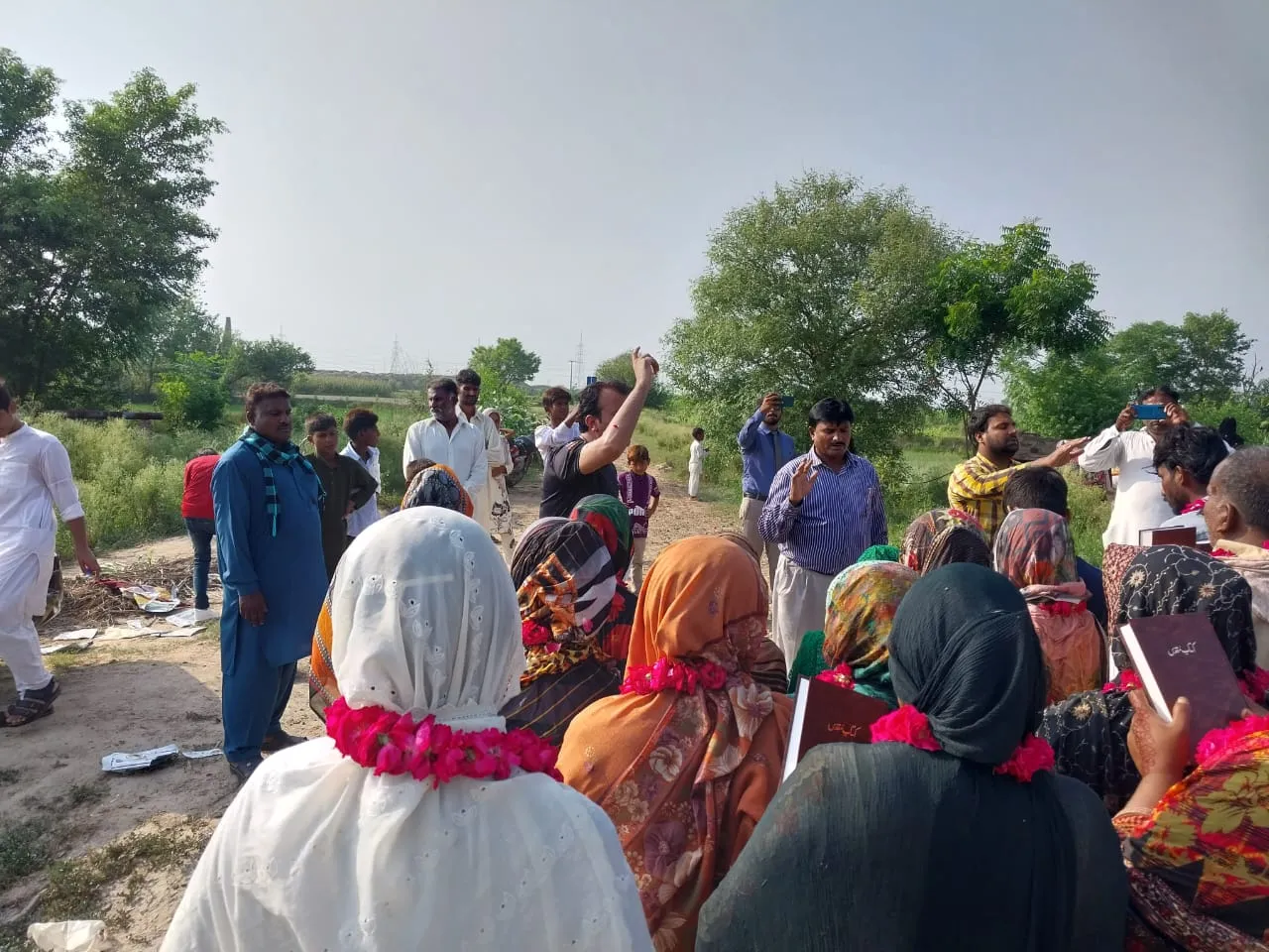 New believers being baptized