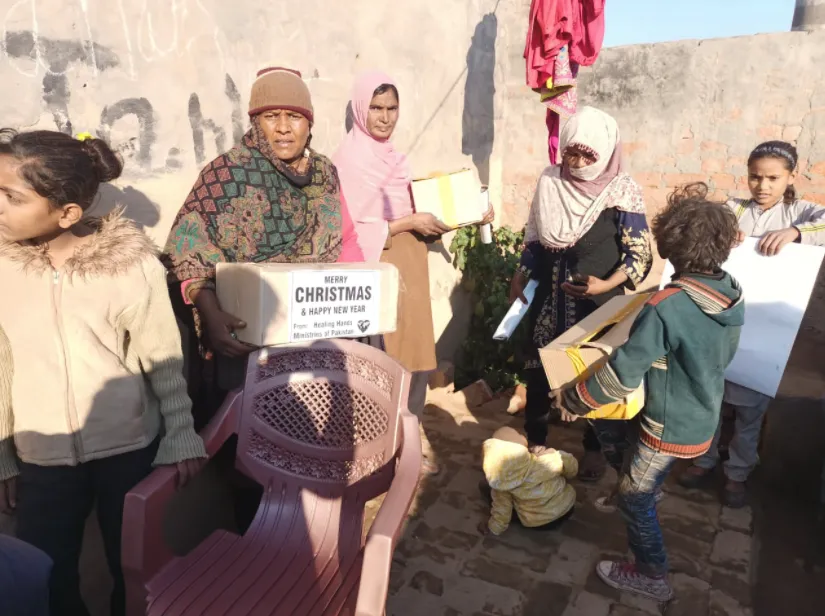 Children receiving Christmas gifts