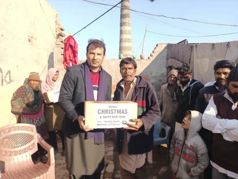 Children receiving Christmas gifts